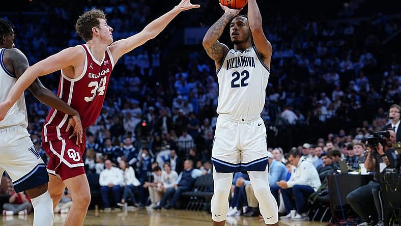 Dec 3, 2022; Philadelphia, Pennsylvania, USA; Villanova Wildcats forward Cam Whitmore (22) shoots a three point jump shot against Oklahoma Sooners forward Jacob Groves (34)during the second half at Wells Fargo Center. Mandatory Credit: Gregory Fisher-USA TODAY Sports