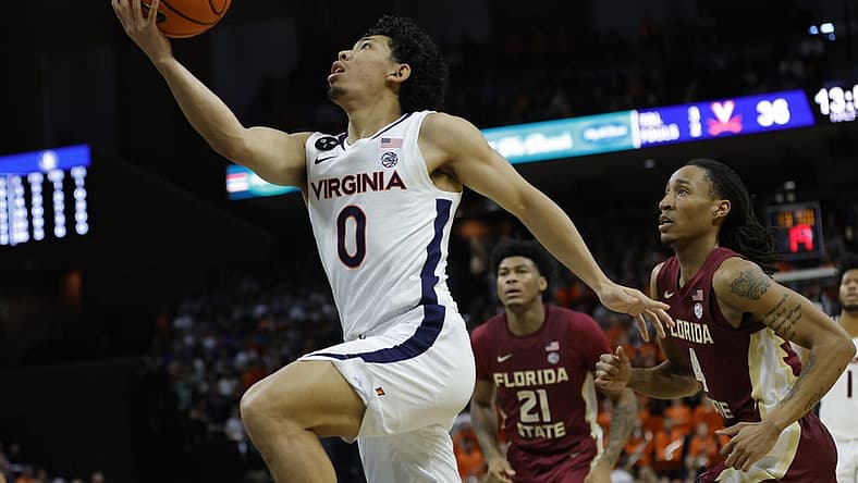 Dec 3, 2022; Charlottesville, Virginia, USA; Virginia Cavaliers guard Kihei Clark (0) shoots the ball as Florida State Seminoles guard Caleb Mills (4) looks on in the second half at John Paul Jones Arena. Mandatory Credit: Geoff Burke-USA TODAY Sports