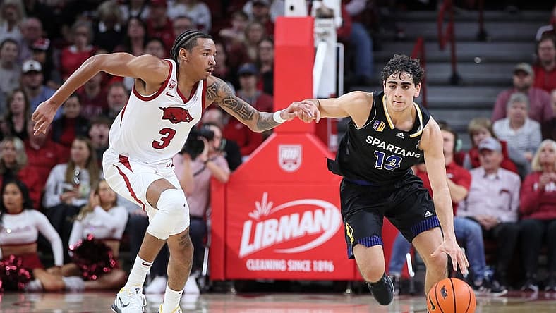 Dec 3, 2022; Fayetteville, Arkansas, USA; San Jose State Spartans guard Alvaro Cardenas (13) drives against Arkansas Razorbacks guard Nick Smith Jr (3) during the first half at Bud Walton Arena. Mandatory Credit: Nelson Chenault-USA TODAY Sports