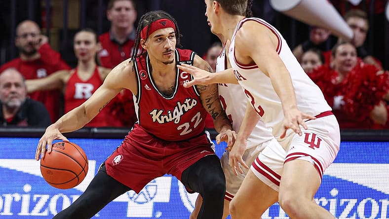 Dec 3, 2022; Piscataway, New Jersey, USA; Rutgers Scarlet Knights guard Caleb McConnell (22) dribbles against Indiana Hoosiers forward Miller Kopp (12) during the first half at Jersey Mike's Arena. Mandatory Credit: Vincent Carchietta-USA TODAY Sports
