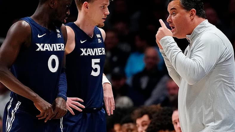 Xavier Musketeers head coach Sean Miller directs guard Souley Boum (0) and guard Adam Kunkel (5) in the first half of the NCAA basketball game between the Xavier Musketeers and the West Virginia Mountaineers at the Cintas Center in Cincinnati on Saturday, Dec. 3, 2022. The Mountaineers led 43-36 at halftime.
West Virginia Mountaineers At Xavier Musketeers Basketball