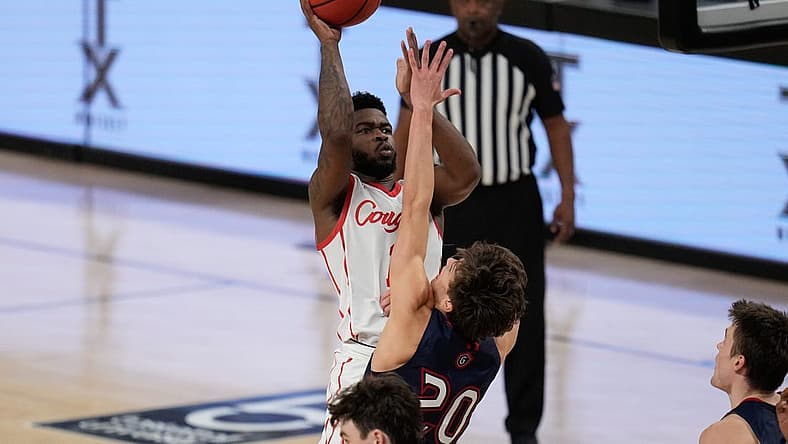 Dec 3, 2022; Fort Worth, Texas, USA; Houston Cougars guard Jamal Shead (1) makes a shot over St. Mary's Gaels guard Aidan Mahaney (20) during the second half at Dickies Arena. Mandatory Credit: Chris Jones-USA TODAY Sports
