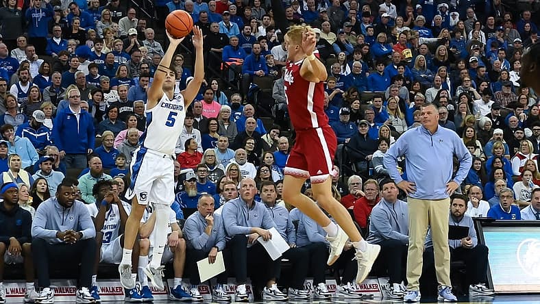 Dec 4, 2022; Omaha, Nebraska, USA;  Creighton Bluejays guard Francisco Farabello (5) scores on a three point shot over Nebraska Cornhuskers guard Sam Griesel (5) in the second half at CHI Health Center Omaha. Mandatory Credit: Steven Branscombe-USA TODAY Sports