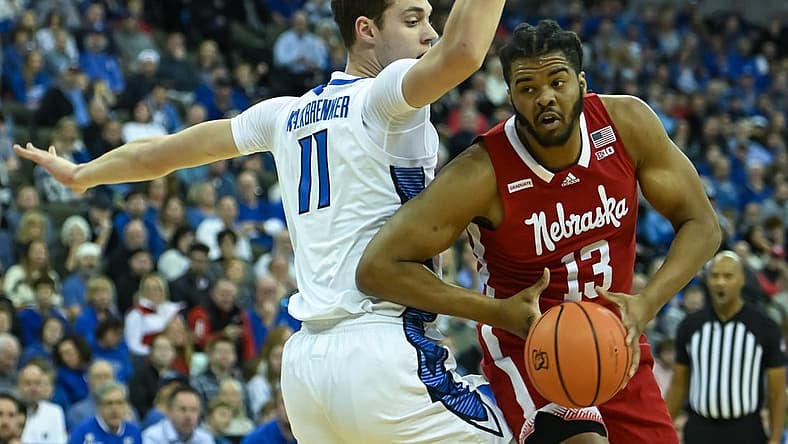 Dec 4, 2022; Omaha, Nebraska, USA; Nebraska Cornhuskers forward Derrick Walker (13) scores against Creighton Bluejays center Ryan Kalkbrenner (11) in the first half at CHI Health Center Omaha. Mandatory Credit: Steven Branscombe-USA TODAY Sports