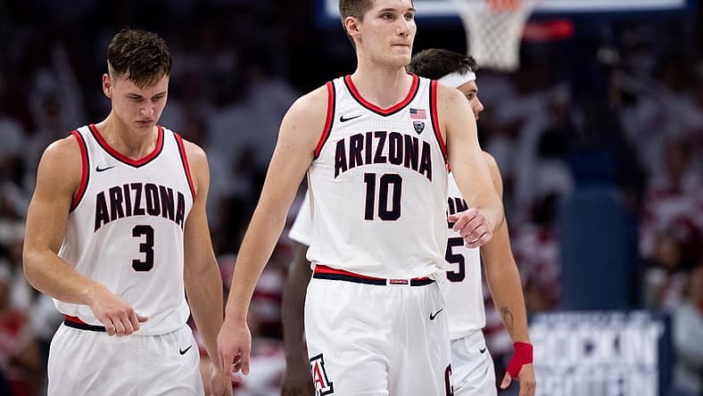 Dec 4, 2022; Tucson, Arizona, USA; Arizona Wildcats forward Azuolas Tubelis (10), guard Pelle Larsson (3), and guard Kerr Kriisa (25) walk back to the bench during the second half against the Cal Golden Bears at McKale Center. Mandatory Credit: Zachary BonDurant-USA TODAY Sports