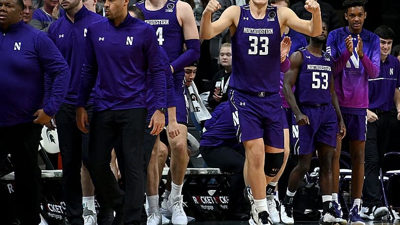 Dec 4, 2022; East Lansing, Michigan, USA; Northwestern Wildcats forward Luke Hunger (33) celebrates their win against the Michigan State Spartans at Jack Breslin Student Events Center. Mandatory Credit: Dale Young-USA TODAY Sports