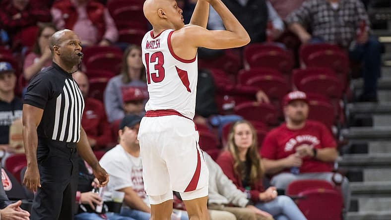 Dec 6, 2022; Fayetteville, Arkansas, USA;  Arkansas Razorbacks guard Jordan Walsh (13) shoots the ball during the first half against the UNC-Greensboro Spartans at Bud Walton Arena. Mandatory Credit: Brett Rojo-USA TODAY Sports