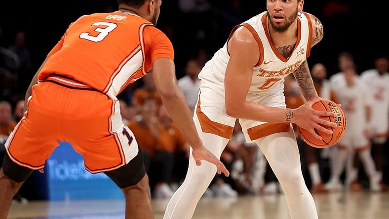 Dec 6, 2022; New York, New York, USA; Texas Longhorns forward Timmy Allen (0) controls the ball against Illinois Fighting Illini guard Jayden Epps (3) during the first half at Madison Square Garden. Mandatory Credit: Brad Penner-USA TODAY Sports