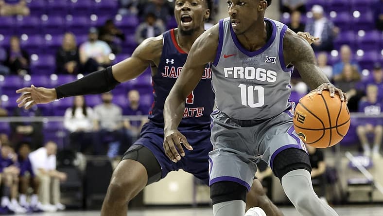Dec 6, 2022; Fort Worth, Texas, USA; TCU Horned Frogs guard Damion Baugh (10) controls the ball as Jackson State Tigers guard Coltie Young (4) defends during the first half at Ed and Rae Schollmaier Arena. Mandatory Credit: Kevin Jairaj-USA TODAY Sports
