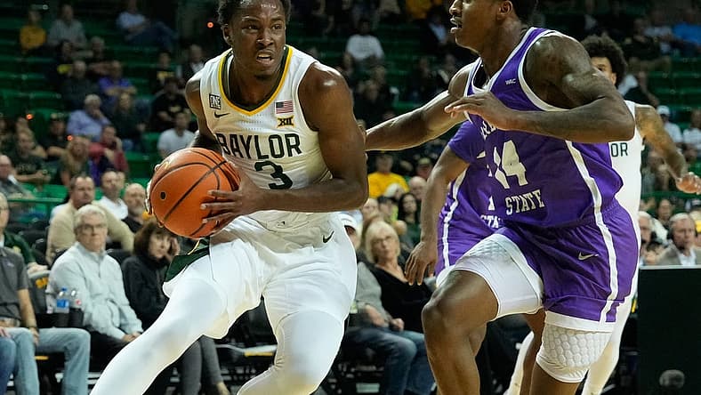 Dec 6, 2022; Waco, Texas, USA;  Baylor Bears guard Dale Bonner (3) drives to the basket against Tarleton Texans guard Javontae Hopkins (14) during the first half at Ferrell Center. Mandatory Credit: Chris Jones-USA TODAY Sports