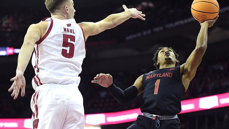 Dec 6, 2022; Madison, Wisconsin, USA; Maryland Terrapins guard Jahmir Young (1) shoots under coverage by Wisconsin Badgers forward Tyler Wahl (5) during the first half at the Kohl Center. Mandatory Credit: Kayla Wolf-USA TODAY Sports