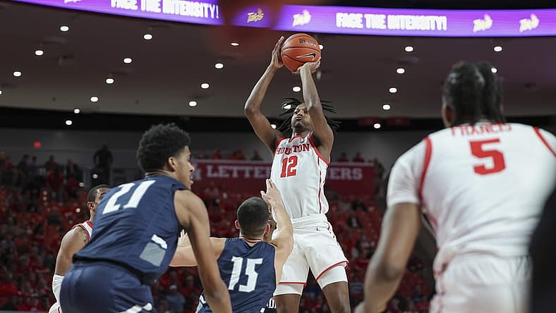 Dec 6, 2022; Houston, Texas, USA; Houston Cougars guard Tramon Mark (12) shoots the ball during the first half against the North Florida Ospreys at Fertitta Center. Mandatory Credit: Troy Taormina-USA TODAY Sports