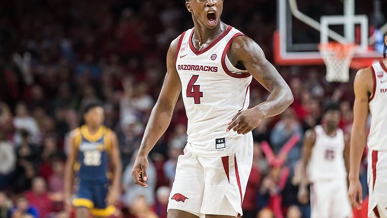 Dec 6, 2022; Fayetteville, Arkansas, USA; Arkansas Razorbacks guard Davonte Davis (4) yells after a UNC-Greensboro Spartans turnover during the second half at Bud Walton Arena. Arkansas won 65-58. Mandatory Credit: Brett Rojo-USA TODAY Sports