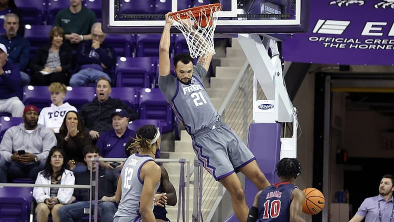Dec 6, 2022; Fort Worth, Texas, USA;  TCU Horned Frogs forward JaKobe Coles (21) dunks during the second half against the Jackson State Tigers at Ed and Rae Schollmaier Arena. Mandatory Credit: Kevin Jairaj-USA TODAY Sports