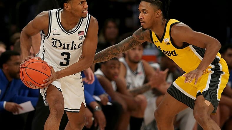 Dec 6, 2022; New York, New York, USA; Duke Blue Devils guard Jeremy Roach (3) controls the ball against Iowa Hawkeyes guard Ahron Ulis (1) during the second half at Madison Square Garden. Mandatory Credit: Brad Penner-USA TODAY Sports