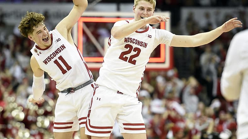 Dec 6, 2022; Madison, Wisconsin, USA; Wisconsin Badgers guard Max Klesmit (11) and forward Steven Crowl (22) celebrate their win over the Maryland Terrapins at the Kohl Center. Mandatory Credit: Kayla Wolf-USA TODAY Sports