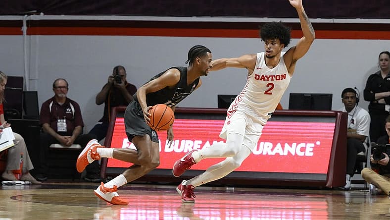 Dec 7, 2022; Blacksburg, Virginia, USA; Virginia Tech Hokies guard Darius Maddox (13) dribbles around Dayton Flyers forward Toumani Camara (2) in the first half at Cassell Coliseum. Mandatory Credit: Lee Luther Jr.-USA TODAY Sports