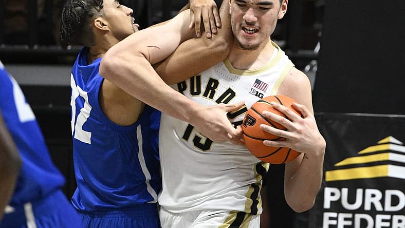Dec 7, 2022; West Lafayette, Indiana, USA; Purdue Boilermakers center Zach Edey (15) and Hofstra Pride forward Nelson Boachie-Yiadom (32) fight for a ball during the second half at Mackey Arena. Boilermakers defeated the Pride 85-66. Mandatory Credit: Marc Lebryk-USA TODAY Sports
