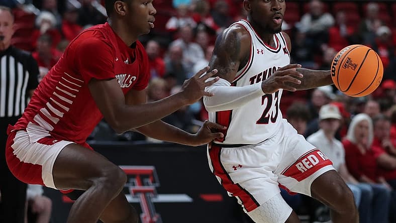 Dec 7, 2022; Lubbock, Texas, USA; Texas Tech Red Raiders guard De Vion Harmon (23) dribbles the ball against Nicholls Colonels forward Mekhi Collins (13) in the first half at United Supermarkets Arena. Mandatory Credit: Michael C. Johnson-USA TODAY Sports