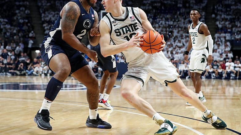 Dec 7, 2022; University Park, Pennsylvania, USA; Penn State Nittany Lions guard/forward Myles Dread (2) defends as Michigan State Spartans forward Joey Hauser (10) drives the ball to the basket during the second half at Bryce Jordan Center. Michigan State defeated Penn State 67-58. Mandatory Credit: Matthew OHaren-USA TODAY Sports