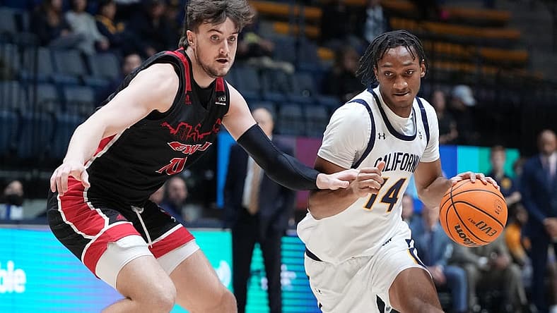 December 7, 2022; Berkeley, California, USA; California Golden Bears forward Grant Newell (14) dribbles the basketball against Eastern Washington Eagles forward Ethan Price (10) during the first half at Haas Pavilion. Mandatory Credit: Kyle Terada-USA TODAY Sports