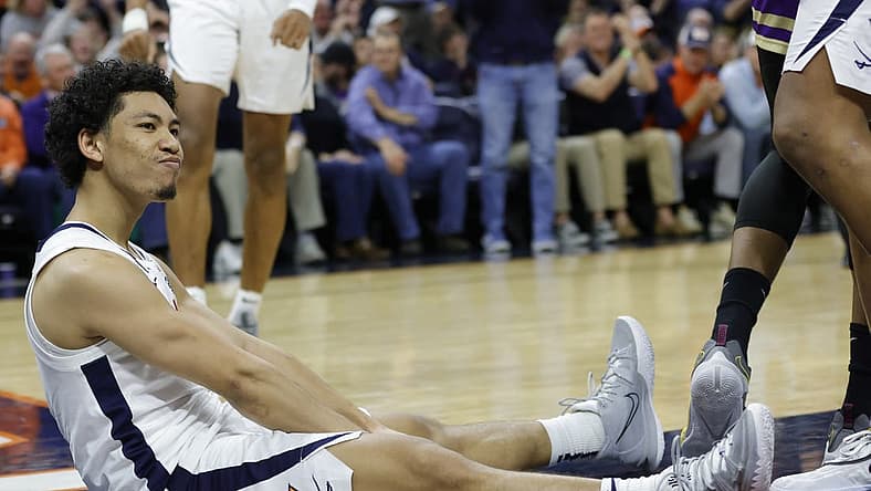 Dec 6, 2022; Charlottesville, Virginia, USA; Virginia Cavaliers guard Kihei Clark (0) reacts after scoring while being fouled James Madison Dukes in the second half at John Paul Jones Arena. Mandatory Credit: Geoff Burke-USA TODAY Sports
