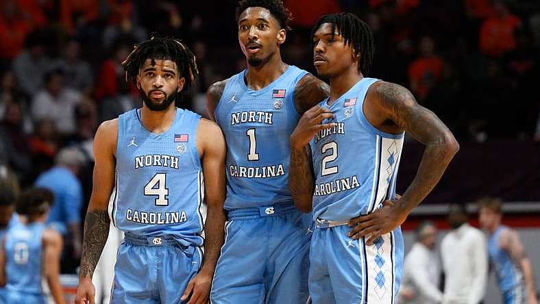 Dec 4, 2022; Blacksburg, Virginia, USA; North Carolina Tar Heels guard R.J. Davis (4) forward Leaky Black (1) and guard Caleb Love (2) at mid court during a Virginia Tech Hokies foul shot at Cassell Coliseum. Mandatory Credit: Lee Luther Jr.-USA TODAY Sports