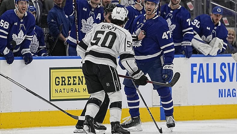Dec 8, 2022; Toronto, Ontario, CAN; Toronto Maple Leafs forward Pierre Engvall (47) and Los Angeles Kings defenseman Sean Durzi (50) exchange words after a hit during the third period at Scotiabank Arena. Mandatory Credit: John E. Sokolowski-USA TODAY Sports