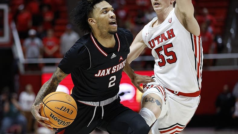 Dec 8, 2022; Salt Lake City, Utah, USA; Jacksonville State Gamecocks guard Cam McDowell (2) looks to drive against Utah Utes guard Gabe Madsen (55) in the first half at Jon M. Huntsman Center. Mandatory Credit: Jeffrey Swinger-USA TODAY Sports