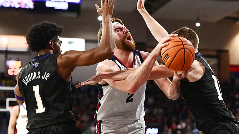 Dec 9, 2022; Spokane, Washington, USA; Gonzaga Bulldogs forward Drew Timme (2) is fouled on the shot by Washington Huskies forward Jackson Grant (12) in the first half at McCarthey Athletic Center. Mandatory Credit: James Snook-USA TODAY Sports