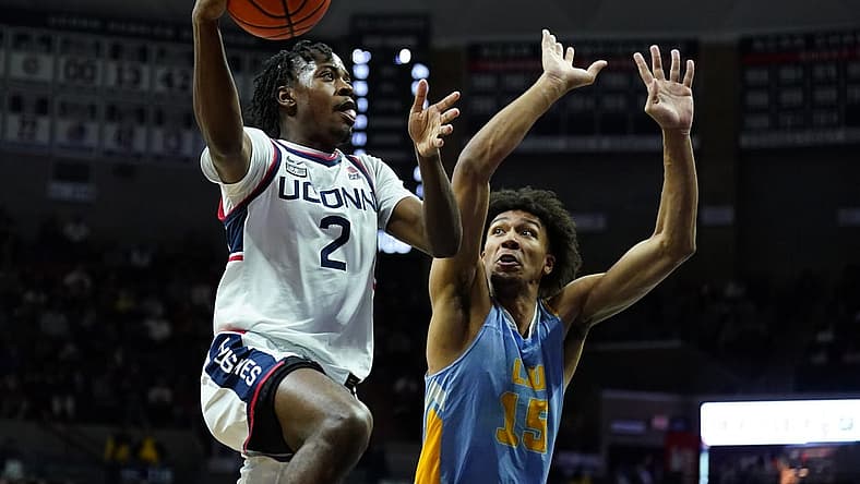 Dec 10, 2022; Storrs, Connecticut, USA; UConn Huskies guard Tristen Newton (2) shoots against Long Island Sharks forward/center C.J. Delancy (15) in the first half at Harry A. Gampel Pavilion. Mandatory Credit: David Butler II-USA TODAY Sports