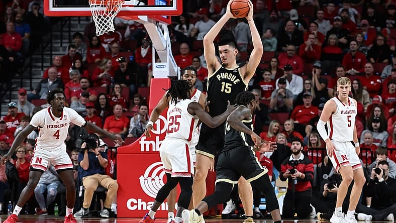 Dec 10, 2022; Lincoln, Nebraska, USA;  Purdue Boilermakers center Zach Edey (15) holds the ball high against the Nebraska Cornhuskers in the first half at Pinnacle Bank Arena. Mandatory Credit: Steven Branscombe-USA TODAY Sports