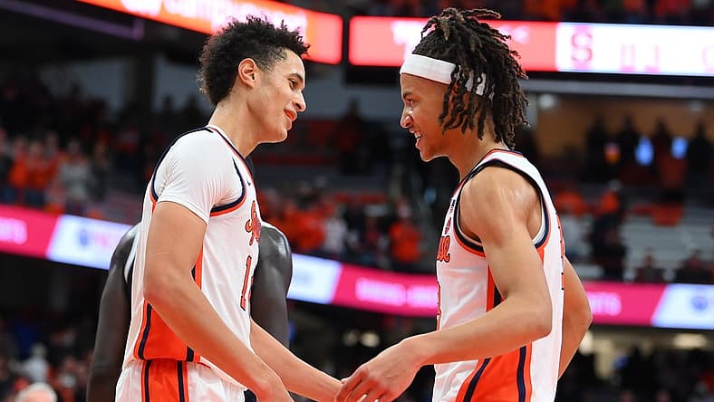 Dec 10, 2022; Syracuse, New York, USA; Syracuse Orange center Jesse Edwards (left) and forward Benny Williams (right) celebrate following the game against the Georgetown Hoyas at the JMA Wireless Dome. Mandatory Credit: Rich Barnes-USA TODAY Sports
