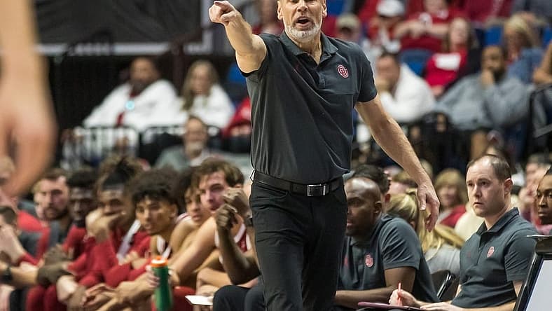 Dec 10, 2022; Tulsa, Oklahoma, USA; Oklahoma Sooners head coach Porter Moser yells towards his players on the court during the first half against the Arkansas Razorbacks at BOK Center. Arkansas won 88-78. Mandatory Credit: Brett Rojo-USA TODAY Sports