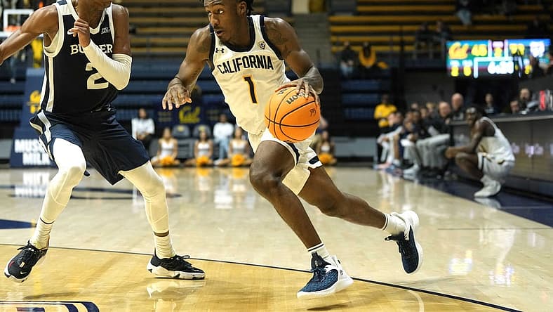 Dec 10, 2022; Berkeley, California, USA; California Golden Bears guard Joel Brown (1) dribbles against Butler Bulldogs guard Eric Hunter Jr. (2) during the second half at Haas Pavilion. Mandatory Credit: Darren Yamashita-USA TODAY Sports