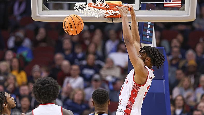 Dec 10, 2022; Newark, New Jersey, USA; Boston College Eagles forward Devin McGlockton (21) dunks the ball against Villanova Wildcats forward Eric Dixon (43) during the second half at Prudential Center. Mandatory Credit: Vincent Carchietta-USA TODAY Sports