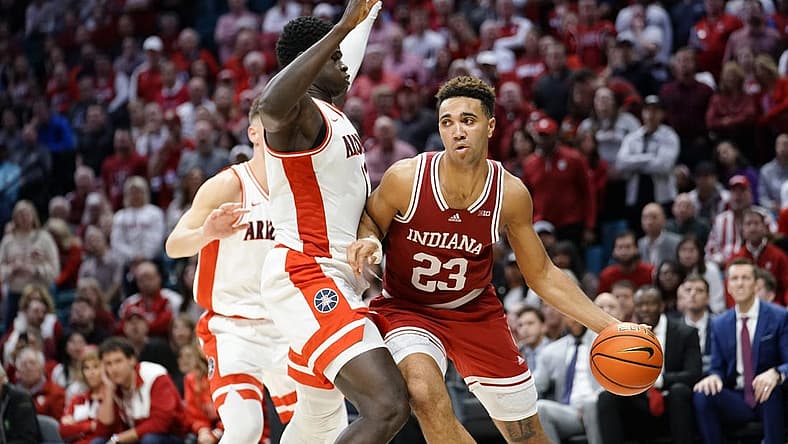 Dec 10, 2022; Las Vegas, Nevada, USA; Indiana Hoosiers forward Trayce Jackson-Davis (23) controls the ball against Arizona Wildcats center Oumar Ballo (11) during the second half at MGM Grand Garden Arena. Mandatory Credit: Lucas Peltier-USA TODAY Sports