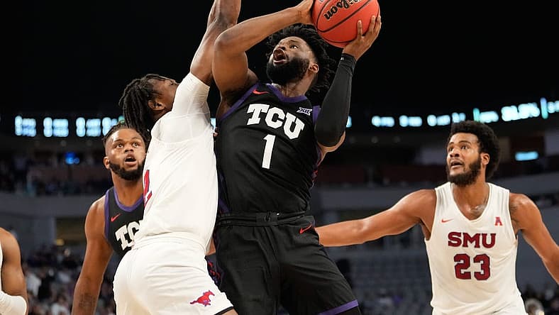 Dec 10, 2022; Fort Worth, Texas, USA;  TCU Horned Frogs guard Mike Miles Jr. (1) shoots the ball against Southern Methodist Mustangs guard Jalen Smith (2) during the first half at Dickies Arena. Mandatory Credit: Chris Jones-USA TODAY Sports