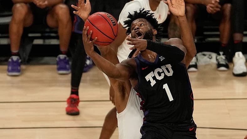 Dec 10, 2022; Fort Worth, Texas, USA; TCU Horned Frogs guard Mike Miles Jr. (1) shoots the ball against Southern Methodist Mustangs forward Keon Ambrose-Hylton (22) during the second half at Dickies Arena. Mandatory Credit: Chris Jones-USA TODAY Sports