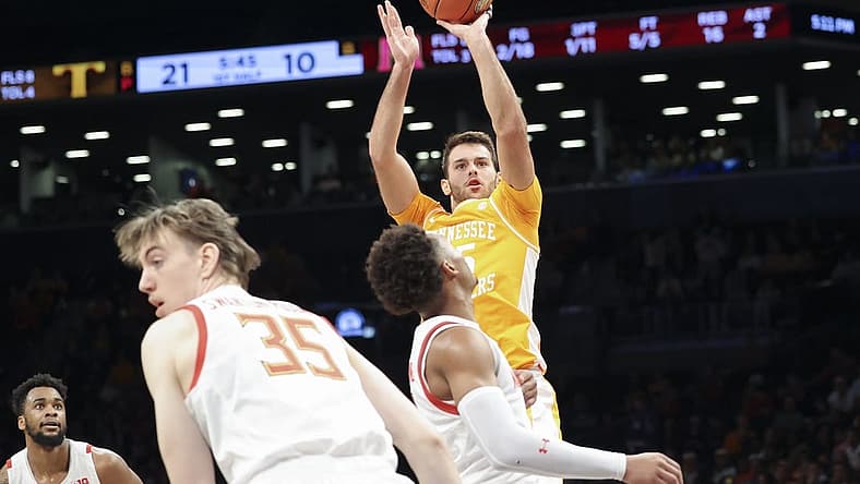 Dec 11, 2022; Brooklyn, New York, USA; Tennessee Volunteers guard Santiago Vescovi (25) shoots against the Maryland Terrapins during the first half at Barclays Center. Mandatory Credit: Jessica Alcheh-USA TODAY Sports