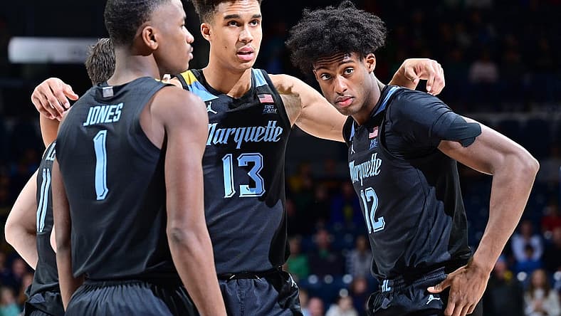 Dec 11, 2022; South Bend, Indiana, USA; Marquette Golden Eagles guard Kam Jones (1), forward Oso Ighodaro (13) and forward Olivier-Maxence Prosper (12) huddle before the game against the Notre Dame Fighting Irish at the Purcell Pavilion. Mandatory Credit: Matt Cashore-USA TODAY Sports