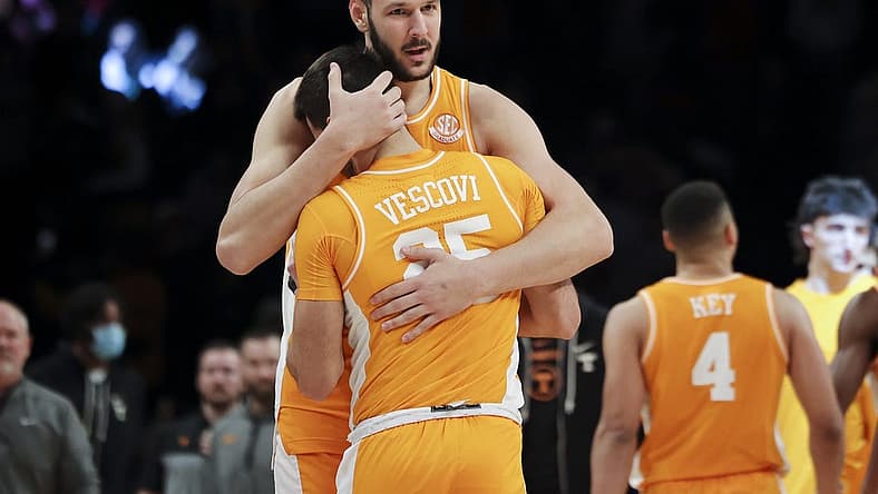 Dec 11, 2022; Brooklyn, New York, USA; Tennessee Volunteers forward Uros Plavsic (33) embraces Tennessee Volunteers guard Santiago Vescovi (25) after the Tennessee Volunteers defeat the Maryland Terrapins 56-53 at Barclays Center. Mandatory Credit: Jessica Alcheh-USA TODAY Sports