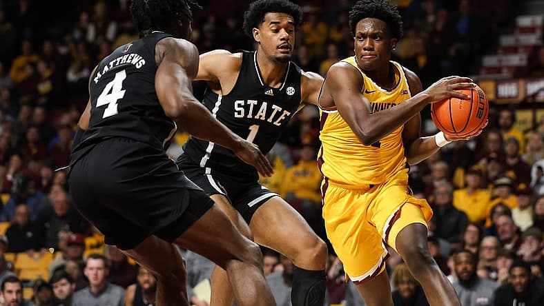 Dec 11, 2022; Minneapolis, Minnesota, USA; Minnesota Golden Gophers forward Joshua Ola-Joseph (1) looks to pass while Mississippi State Bulldogs forward Tolu Smith (1) and guard Cameron Matthews (4) defends during the first half at Williams Arena. Mandatory Credit: Matt Krohn-USA TODAY Sports
