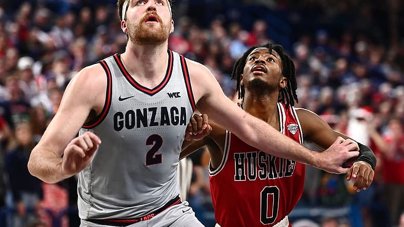 Dec 12, 2022; Spokane, Washington, USA; Northern Illinois Huskies guard Keshawn Williams (0) fights for position against Gonzaga Bulldogs forward Drew Timme (2) in the second half at McCarthey Athletic Center. Gonzaga won 88-67. Mandatory Credit: James Snook-USA TODAY Sports
