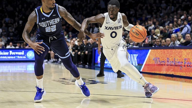 Dec 13, 2022; Cincinnati, Ohio, USA; Southern University Jaguars guard Brion Whitley (22) defends as Xavier Musketeers guard Souley Boum (0) controls the ball in the first half at the Cintas Center. Mandatory Credit: Aaron Doster-USA TODAY Sports