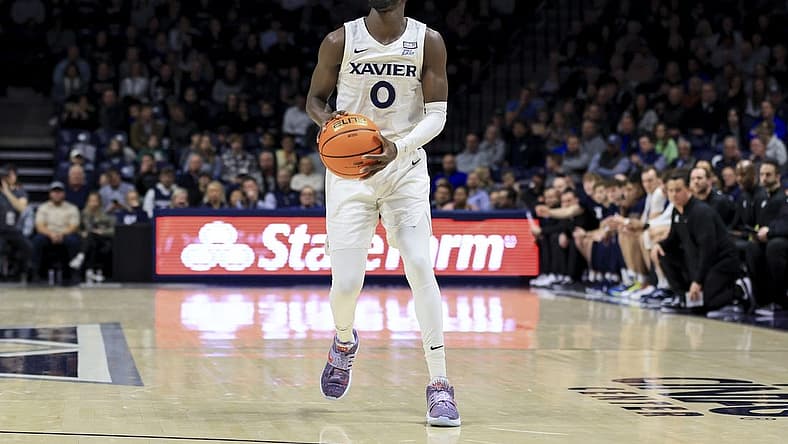 Dec 13, 2022; Cincinnati, Ohio, USA; Xavier Musketeers guard Souley Boum (0) attempts a three-point basket against the Southern University Jaguars in the first half at the Cintas Center. Mandatory Credit: Aaron Doster-USA TODAY Sports