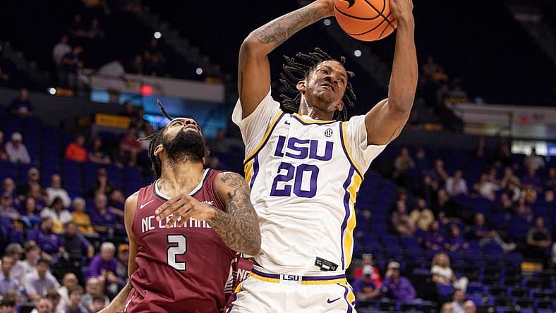 Dec 13, 2022; Baton Rouge, Louisiana, USA; LSU Tigers forward Derek Fountain (20) grabs a rebound against North Carolina Central Eagles forward Kris Monroe (2) during the first half at Pete Maravich Assembly Center. Mandatory Credit: Stephen Lew-USA TODAY Sports