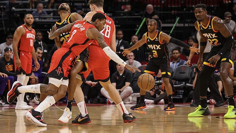 zDec 13, 2022; Houston, Texas, USA; Houston Rockets guard Kevin Porter Jr. (3) dribbles around Phoenix Suns forward Mikal Bridges (25) using center Alperen Sengun (28) as a pick in the first quarter at Toyota Center. Mandatory Credit: Thomas Shea-USA TODAY Sports