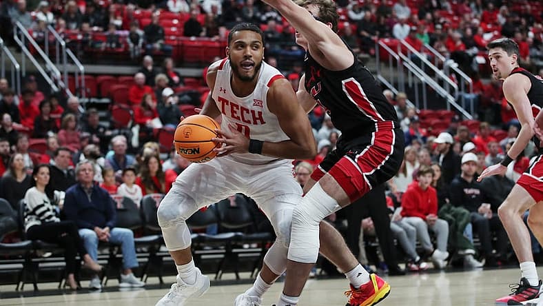 Dec 13, 2022; Lubbock, Texas, USA; Texas Tech Red Raiders forward Kevin Obanor (0) works the ball against Eastern Washington Eagles forward Casey Jones (31) in the first half at United Supermarkets Arena. Mandatory Credit: Michael C. Johnson-USA TODAY Sports