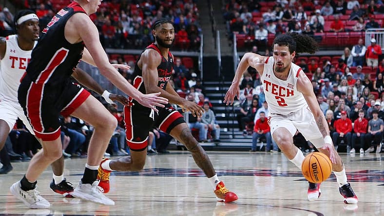 Dec 13, 2022; Lubbock, Texas, USA; Texas Tech Red Raiders guard Pop Isaacs (2) drives to the lane against Eastern Washington Eagles forward Dane Erikstrup (32) in the first half at United Supermarkets Arena. Mandatory Credit: Michael C. Johnson-USA TODAY Sports